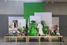 Dodge and Burn (Visible Storage), 2019, Wooden platform, digital photos and printed vinyl on lasercut wood, chromakey fabric, painted backdrops, seasmless paper, artificial plants, mixed media
